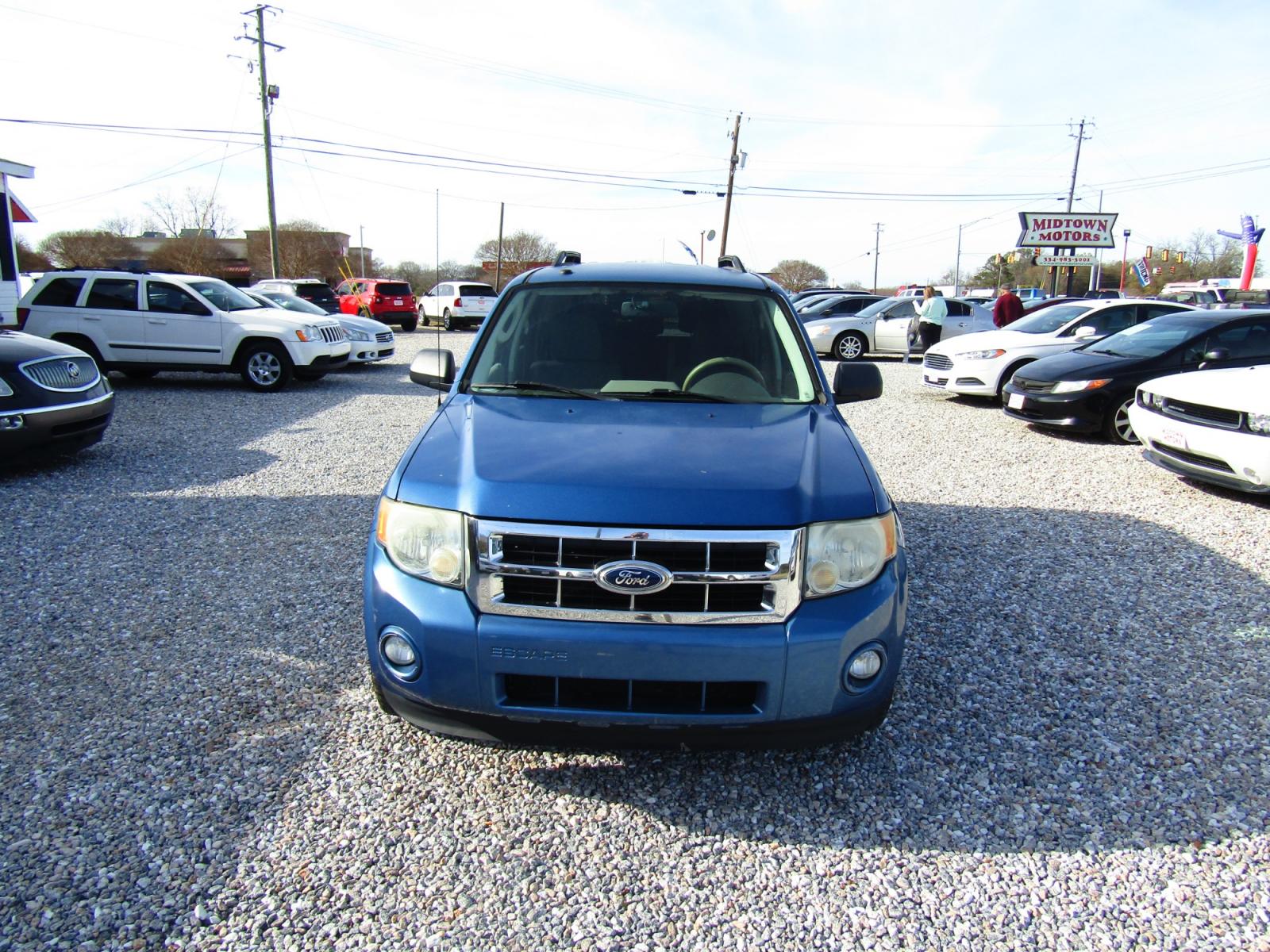 2010 Blue /Black Ford Escape XLT FWD (1FMCU0D72AK) with an 2.5L L4 DOHC 16V engine, Automatic transmission, located at 15016 S Hwy 231, Midland City, AL, 36350, (334) 983-3001, 31.306210, -85.495277 - Photo #1